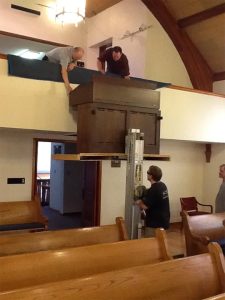 Lowering the old organ.